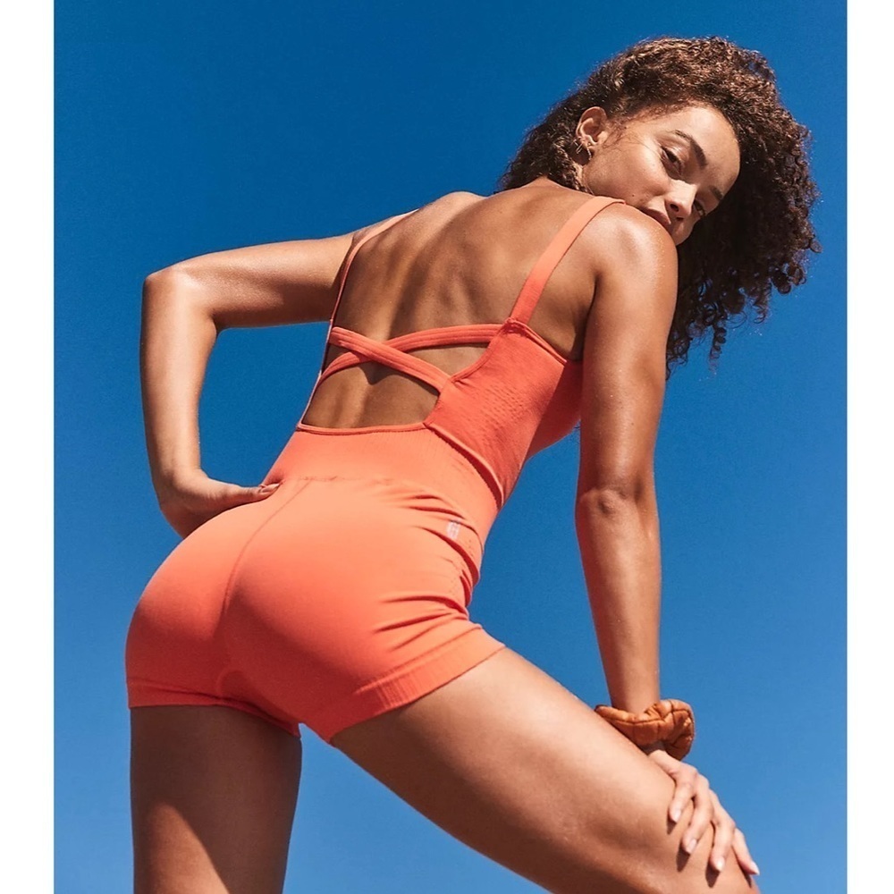 FP Movement by Free People Good Karma Runsie in Papaya Orange, Size M/L